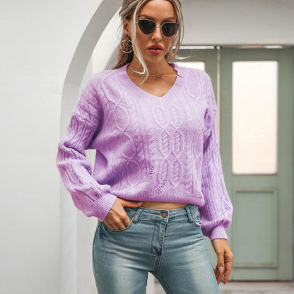 Theanna – V-ringad pullover med lång ärm och elegant twistdesign