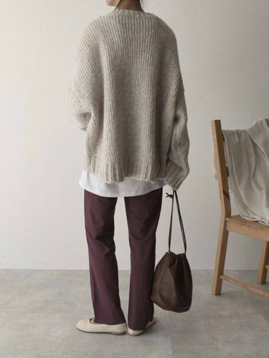 Lennon - Oversized jumper med fickor framtill i elfenben